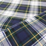 Premium navy and green flannel plaid fabric with yellow and white stripes