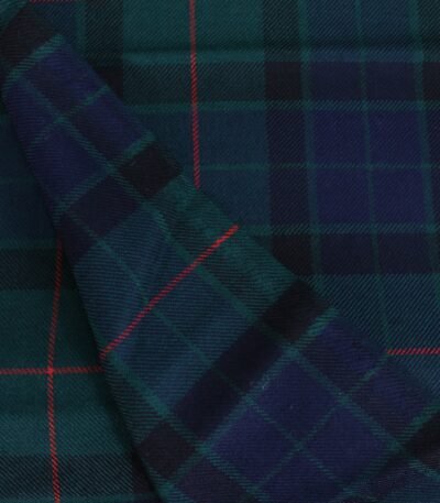 Close up view of soft navy and green cotton flannel plaid fabric with red overcheck