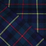 Premium navy and green yarn dyed flannel bedding fabric with yellow and red stripes