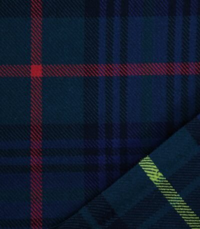 Detailed view of soft navy and green tartan flannel material with red accents