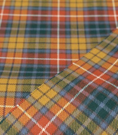 100% cotton Buchanan Tartan fabric in yellow, orange, and green, exported from Multan, Pakistan.