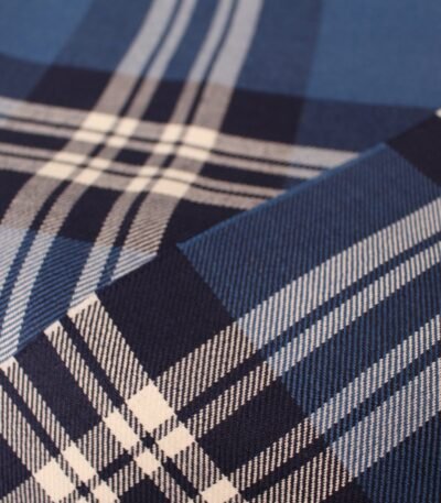 Premium navy and cream plaid flannel fabric with blue and white accents